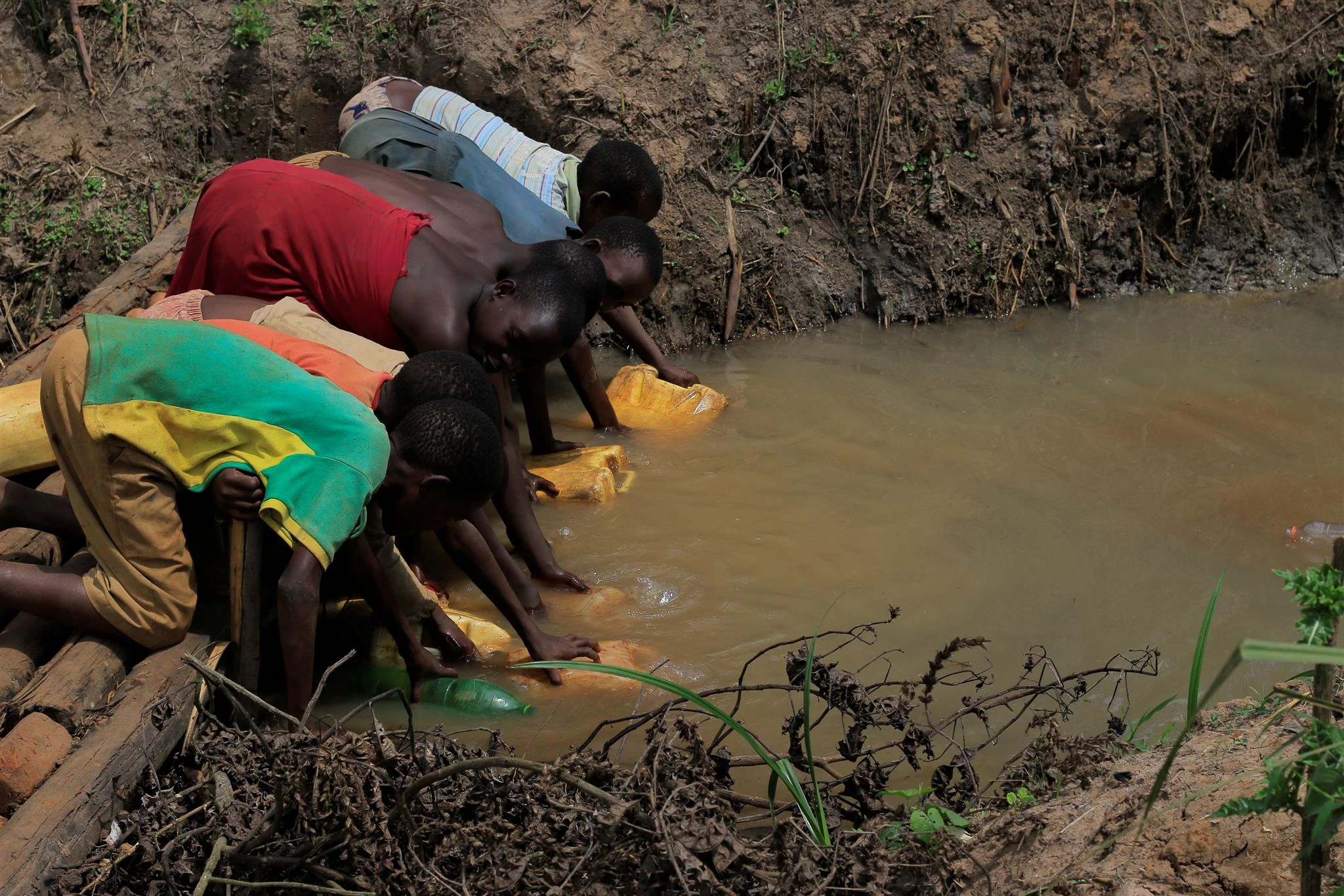 Kids carrying water